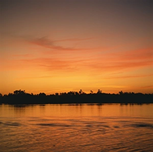 Romantic Skies Prints: The River Nile at sunset, water reflecting evening sky, in Egypt, North Africa, Africa