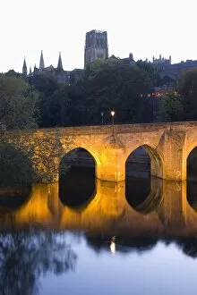 Durham Collection: The River Wear and Elvet Bridge illuminated by night, the cathedral on hillside beyond