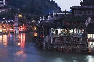 Riverside, old town illuminated at night, Fenghuang, Hunan Province, China, Asia
