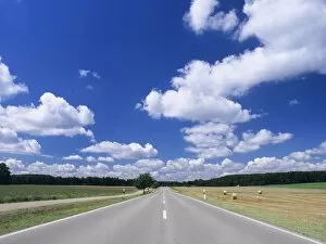 Road and cumulus clouds in summer, Swabian Alb, Baden Wurttemberg, Germany, Europe