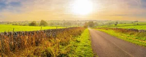 Exploring Prints: Road leading to Monyash with autumn colors and sunny sky in Bakewell