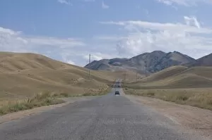 Road leading into the Tian Shan mountains, Kyrgyzstan, Central Asia