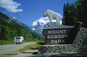 Road and sign for Mount Robson Provincial Park, with mountain in the background