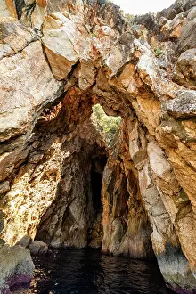 Albania Prints: Rock arch and narrow sea cave entrance found in coastal cliffs of Ionian Sea near Dhermi in Vlor County