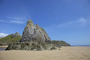 Rock Climbing Prints: Two rock climbers on the Three Cliffs beach in spring morning sunshine