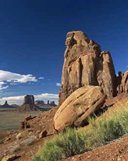 Arid Landscapes Prints: Rock formations caused by erosion in a desert landscape in Monument Valley