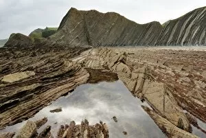 Rock formations (flysch) at low tide on coast between Zumaia and Deba, Costa Vasca