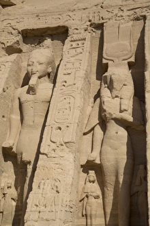 Abu Simbel Prints: Rock-hewn statues of Ramses II on left, and Queen Neferatri on right, Hathor Temple