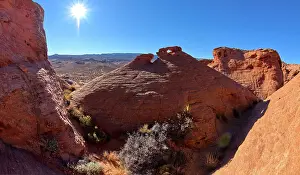 A rock island with a little rock window on its top called the Tea Pot Arch at Ferry Swale in the Glen Canyon Recreation Area near Page, Arizona, United States of America, North America