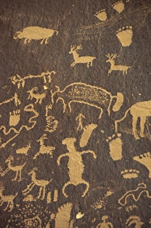 Petroglyphs Prints: Rock petroglyphs of footprints and animals in the Newspaper