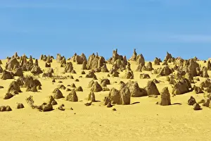 Rock pillars formed by erosion of thick hard layer of calcrete over soft limestone
