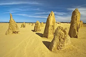 Rock pillars formed by erosion of thick hard layer of calcrete over soft limestone
