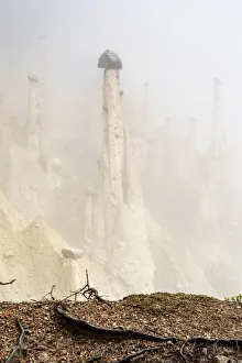 Eroded Prints: Rock pinnacles of the Earth Pyramids emerging from fog, Perca (Percha)
