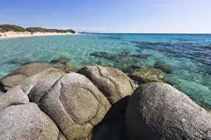 Cagliari Prints: Rocks frame the turquoise water of sea around the sandy beach of Sant Elmo Castiadas
