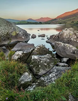 Capel Curig Prints: Rocks and lake at sunrise, Llynnau mymbyr
