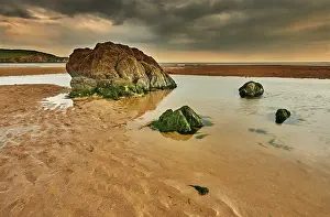 Retreat Prints: Rocks and pools on the beach at low tide in Bigbury-on-Sea, Devon, during an overcast day