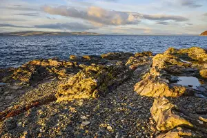 Rocky shore near Catacol looking out across the Kilbrannan Sound to Mull of Kintyre