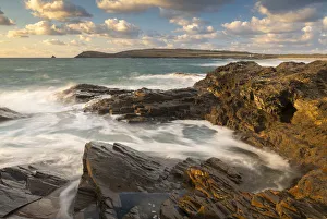 Rocky shoreline of Treyarnon Point at sunset, looking towards Trevose Head, Cornwall