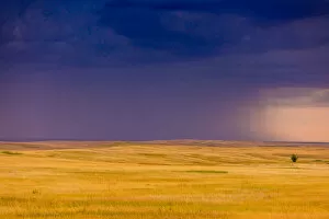 Moody Sky Gallery: Rolling plains against a dark stormy sky in the Badlands, South Dakota