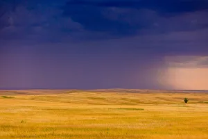 Moody Sky Gallery: Rolling plains against a dark stormy sky in the Badlands, South Dakota