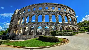Recreational Prints: Roman amphitheater in Pula showcases ancient architecture and history during sunny day in Croatia