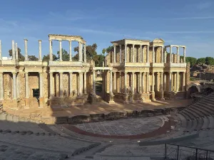 Pillars Prints: Roman Amphitheatre shows ancient architecture with stone seats and columns in a historic site in Spain during daylight