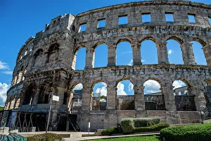 Columns Prints: Roman amphitheatre stands tall in Pula showcasing ancient architecture and history in Croatia