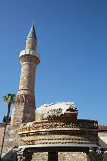 Turkish Prints: Roman ruin with inscription and minaret stand together in Kaleici Antalya Turkey under clear blue sky