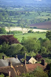 Shaftesbury Prints: Roofs of houses in Shaftesbury and typical patchwork fields beyond, Dorset