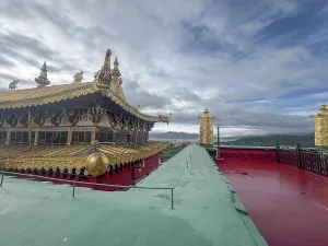 Aesthetic Prints: Rooftop view of Songzanlin Monastery in Shangri-La City Yunnan shows golden decorations