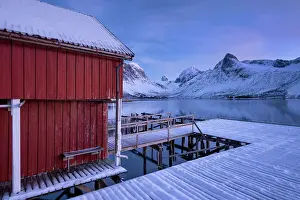 Rorbu Prints: Rorbuer Fishing Hut and wooden jetty overlooking Bergsfjord and the Bergsbotn mountain range
