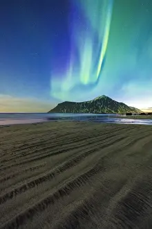 Flakstad Prints: Rough sand of Skagsanden beach lit by green lights of Aurora Borealis (Northern Lights)