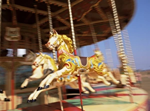 Horse Prints: Roundabout at seaside fairground, Devon, England, United Kingdom, Europe