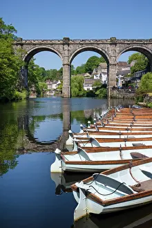 Knaresborough Prints: Row boats for hire in front of the Railway Viaduct over the river Nidd in Knaresborogh