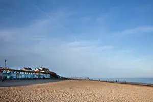 Suffolk Prints: A row of colourful beach-huts on the beach at Southwold in the county of Suffolk