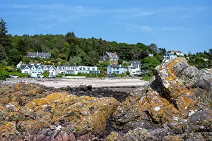 Cottages Prints: Row of houses facing the Rocky beach in Rockcliffe, United Kingdom