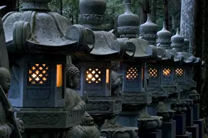 Row of lighted stone lanterns in the Okunoin Temple cemetery at Koyasan (Mount Koya)
