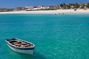 Rowboat in blue sea off coast, Santa Maria, Sal, Cape Verde Islands, Atlantic, Africa