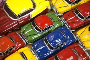 Automobile Collection: Rows of colourful model traditional American cars for sale to tourists