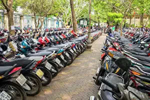 Abundance Prints: Rows of motorbikes parked in central Ho Chi Minh City (Saigon), Vietnam, Indochina