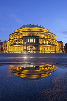 Puddle Prints: Royal Albert Hall reflected in puddle, London, England, United Kingdom, Europe