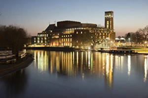 Theatre Prints: Royal Shakespeare Theatre lit up at dusk beside River Avon
