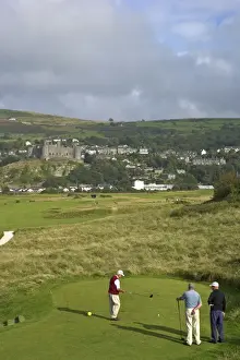 Golfer Prints: Royal St. Davids Golf Club and Harlech Castle in summer sunshine
