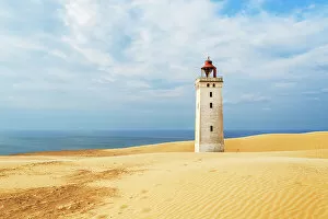 What's New: Rubjerg Knude lighthouse surrounded by sand dunes, Jutland, Denmark, Europe
