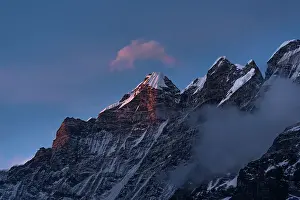 Himalayas Prints: Rugged snowy summit of Langtang Lirung in soft purple light