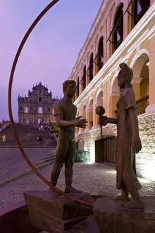 The ruins of Sao Paulo Cathedral viewed through modern street artwork illuminated at dusk