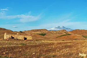 Mount Etna Prints: Rural landscape surrounding the volcano Mount Etna covered with snow in autumn