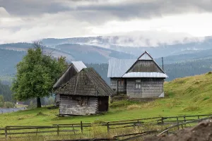 Romania Prints: Rural scene in Maguri village showing traditional houses in the Apuseni mountains during overcast weather