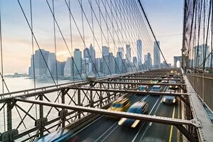 Typically American Gallery: Rush hour traffic on Brooklyn Bridge and Manhattan skyline beyond, New York City