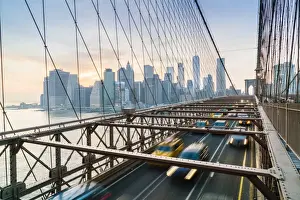 East River Prints: Rush hour traffic on Brooklyn Bridge and Manhattan skyline beyond, New York City